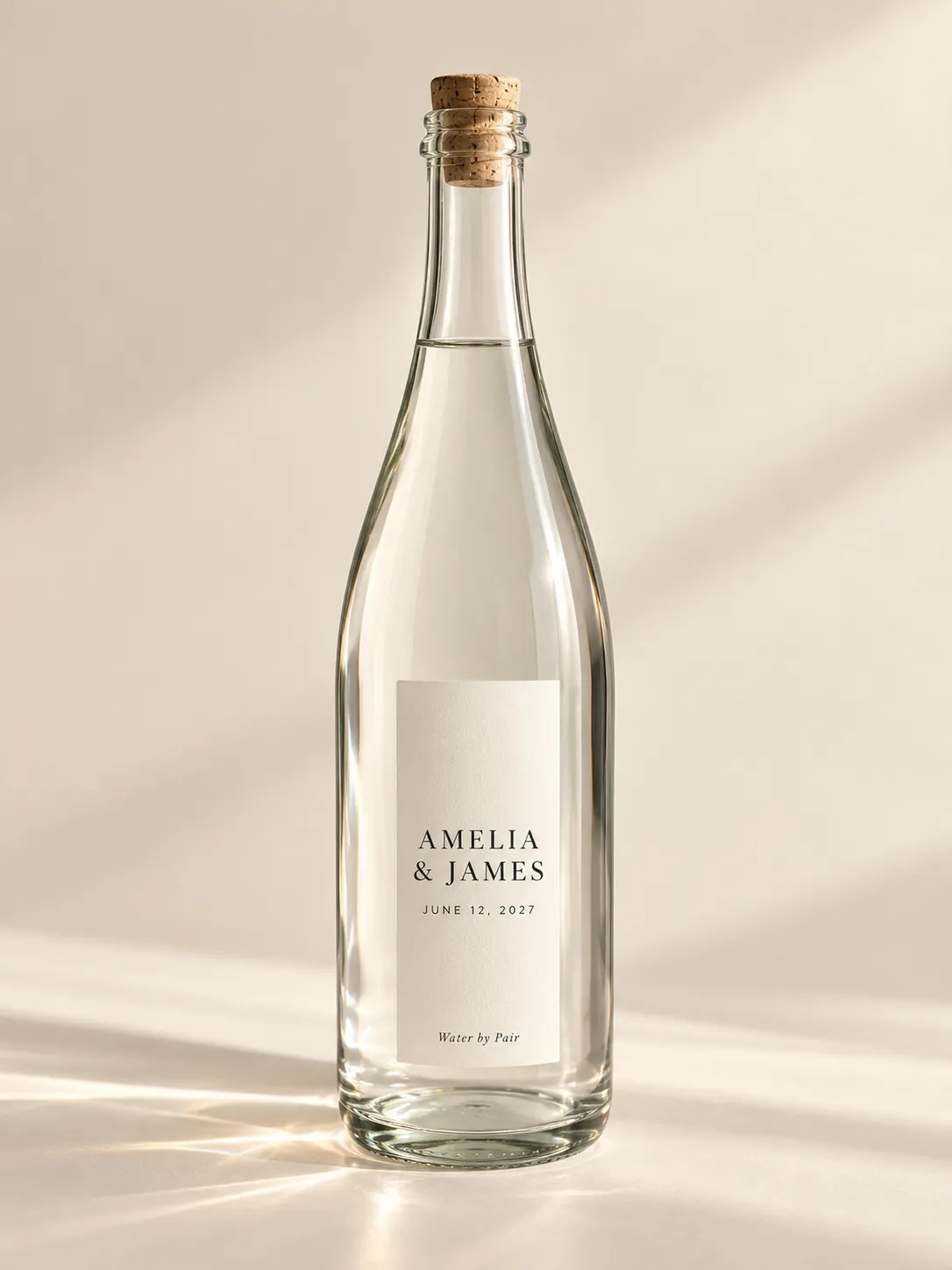 Modern concept bottle with a bright white label set in editorial serif. The names are illustrative.